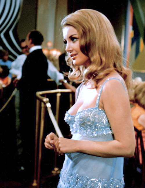 Barbara Bouchet (with David Niven in the background) / production still from Casino Royale (1967)