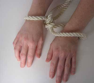 dare-master:   Rope Handcuff Start by making two loops in your rope, each about 10 inches long. Cross the left loop over the right creating a third loop in the center. Thread the loop that is now on the right through the new center loop creating a knot.