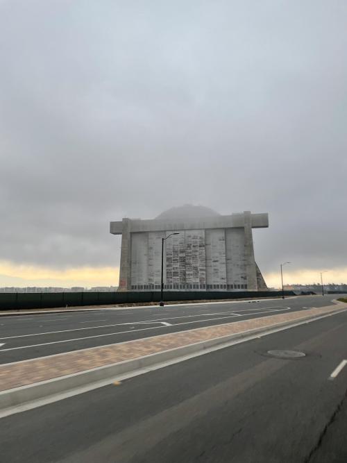 evilbuildingsblog:  Fog creeping around a 1942 WWII blimp hanger in Tustin, CA this morning.