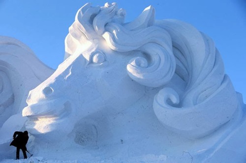 The Magical Harbin Ice Festival, China  A massive and incredibly beautiful snow sculpture at th