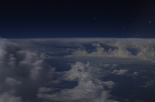 kenobi-wan-obi:     Seen out of an airplane window on a flight across the Pacific Ocean, about 1,500 miles south of Hawaii.      The picture was taken on December 13, 2011. I got lucky, and this hand-held 1.3 second exposure came out reasonably sharp,