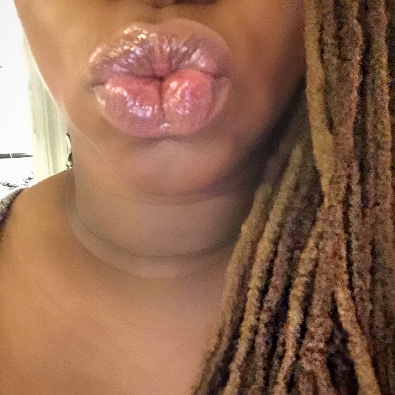 missprimproper:  A very shiny, lip glossy kiss to you all. Happy New Year!