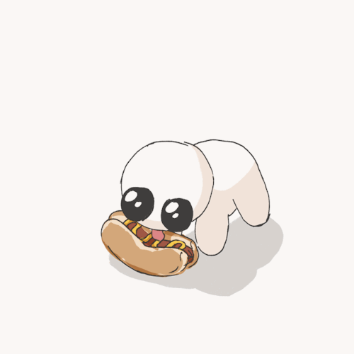 an animated gif of the autism creature peacefully lapping the mustard off a hot dog on the ground.
