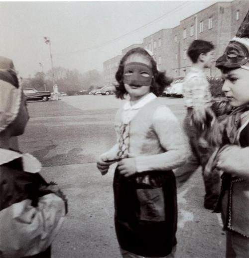 39adamstrand:Barbara in mask, Washington, DC, 1953.How calmly she behaved that day,Bought a knife, s