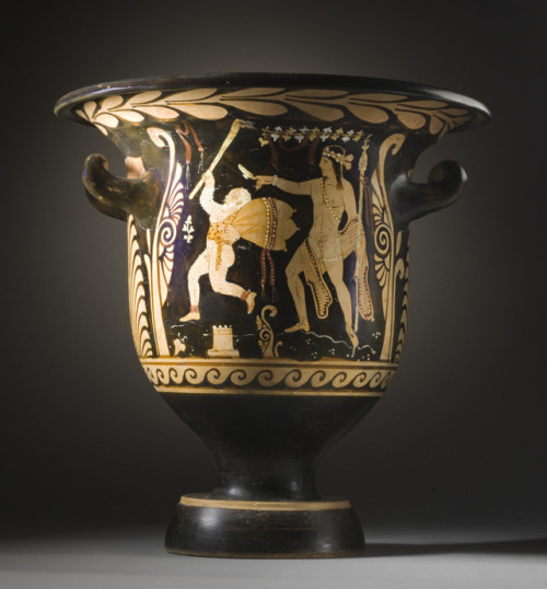 An elderly satyr is followed by the young Dionysus.  South Italian red-figure bell-krater, attribute