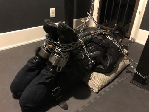 seabondagesadist: The “rest” for @lostinsea88 didn’t last all that long before I decided that it was simply not enough bondage and needed correction. A modified straightjacket hogtie was called for.  His legs pulled up and locked to chains around