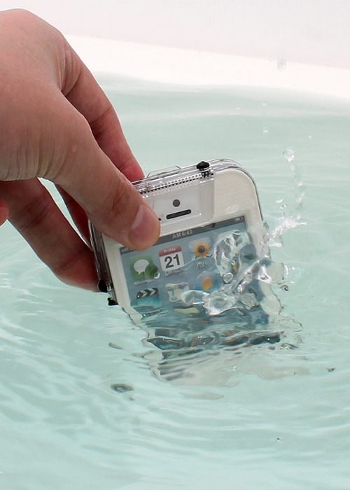 Is this supposed to be art? what is this shit? is he demonstrating a water-proof cell phone case? the fact that modern technology is disposable in the raw face of nature? or did a dumb cocksucker just take a picture of himself dipping an Iphone in water