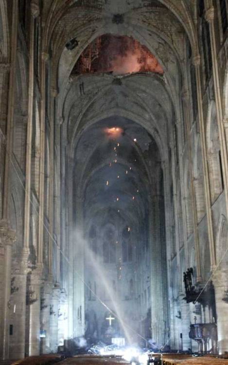 inside the burning cathedral of Notre-Dame of Paris.