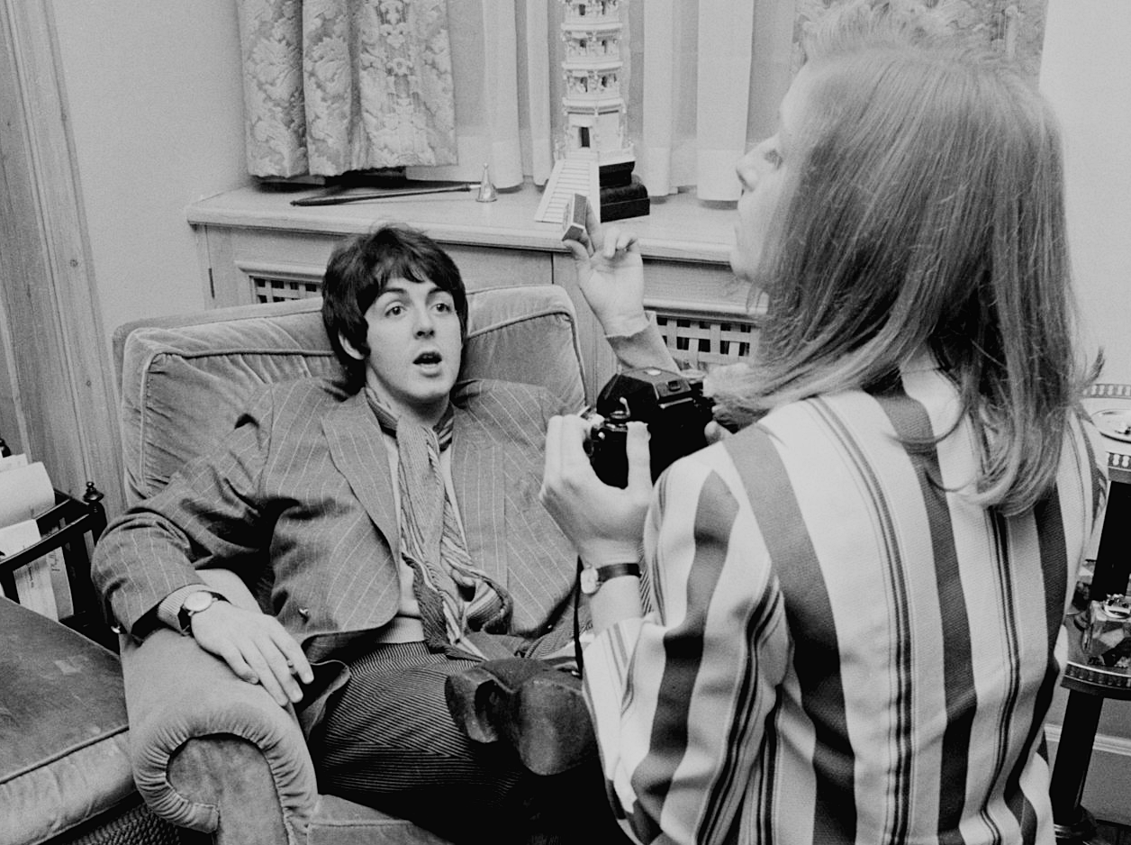 American photographer Linda Eastman takes pictures of Paul McCartney at