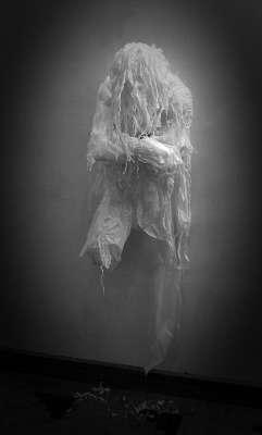 slobbering:  Amazing artwork by Khalil Chishtee  (This creepy wall sculpture was made entirely of white trash-bags with a heat gun.) 
