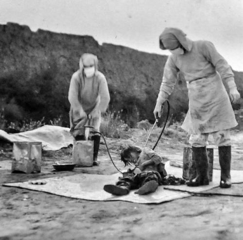 historicaltimes:Personnel of the infamous Unit 731 infecting a chinese civilian with the bubonic pla