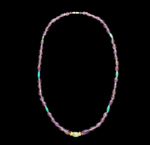 Egyptian amethyst and faience necklace featuring a feldspar scarab at the center c. 2nd to 1st mille