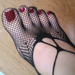 tribal-lion93:  Sexy cherry toes in fishnet