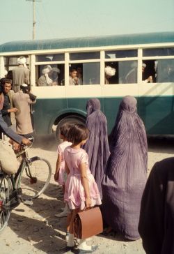  Title: Setting Off  Description: Two Afghan Women, And Their Daughters, Wait