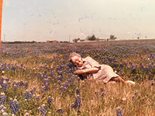 killtheviolinist:My great grandmother Ella Duhon Trahan in a field of flowers.