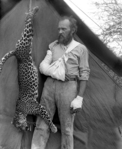 Conservationist and taxidermist Carl Akeley poses, his arms and hands bandaged, beside a leopard he killed with his bare hands, Ethiopia, 1896. Photograph via the Field Museum Library.