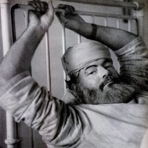 Hemingway recovers in a London hospital in 1944 after an automobile accident.