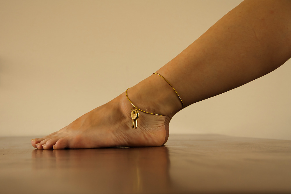 legsandfeetfun:  The key to a chastitycage on her ankle Follow me at http://legsandfeetfun.tumblr.com/