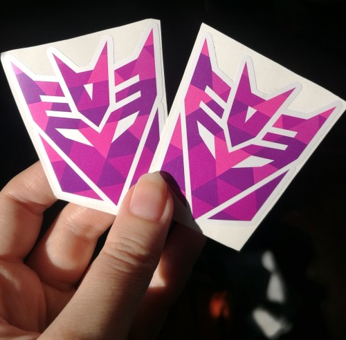 lullishop:I found some geometric Decepticon stickers (two sets of 2) and Mass Effect pins (1 Tali an