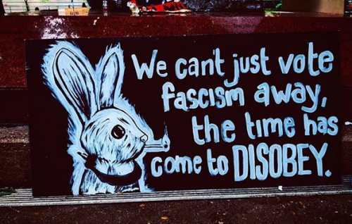 “We can’t just vote fascism away, the time has come to DISOBEY” Seen in Portland, 