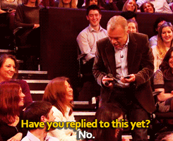  Graham Norton, Lena Dunham, and Idris Elba help an audience member reply to a text
