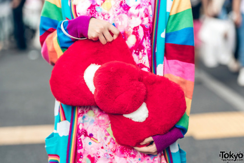 Japanese art student Chami on the street in Harajuku wearing a kawaii colorful look with a handmade 