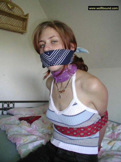 graybandanna:  While she was still bandanna bound and gagged, at least the captor was nice enough to remove the scarf stuffing and the bandanna tied over her mouth