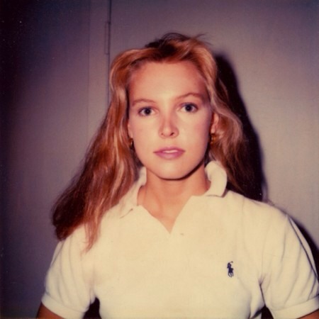 neither:  “The first expression that I read into her was some sort of hesitation. We had a lot of discussions trying to figure out how old this person was when the picture was taken— she could be 15 or 27. The ambiguity of her age and expression