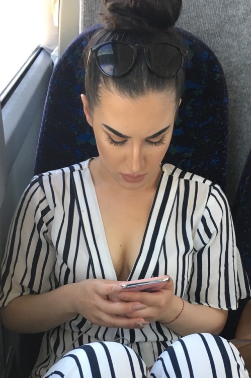 Pretty girl with nice cleavage on the bus