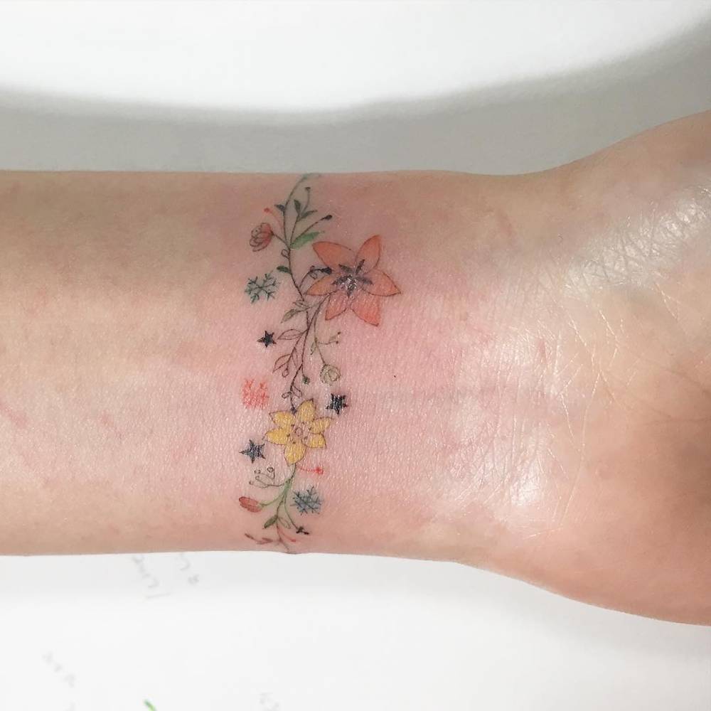 Wrist flower bracelet tattoo | Tattoo bracelet, Wrist bracelet tattoo,  Ankle bracelet tattoo