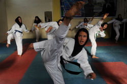 salamalaikum: Afghan girls practice Taekwondo moves during a martial arts class in Herat in January 2013. 