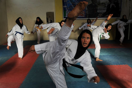 salamalaikum:  Afghan girls practice Taekwondo moves during a martial arts class in Herat in January 2013. 
