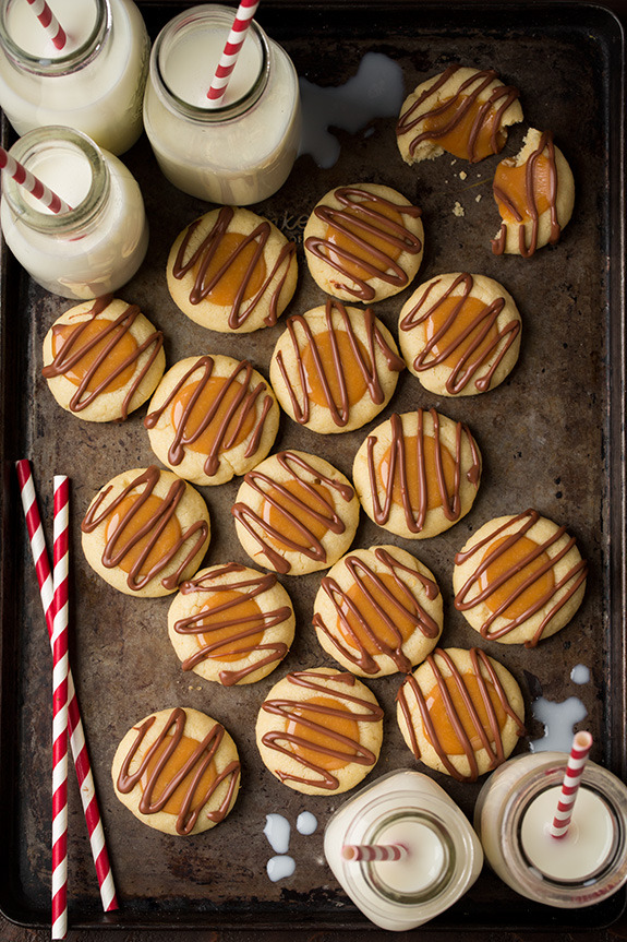 sweetoothgirl:  Twix Thumbprint Cookies  
