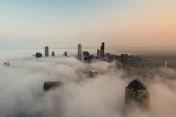 nubbsgalore:  advection fog over chicago, formed as warm, moist air condenses as it moves over the colder air of lake michigan. (click pic or link for credit x, x, x, x, x, x, x, x)