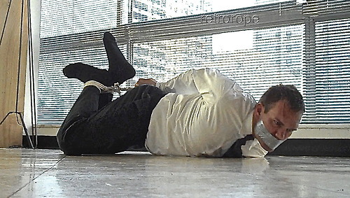 Ms Kay’s note:  Suit and tie and helpless as hell.  Yes, thank you.