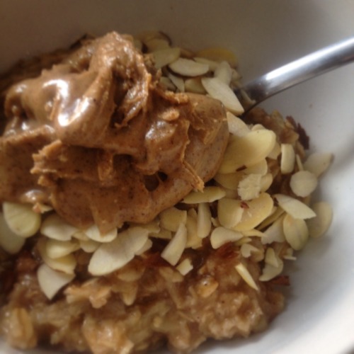 Homemade pumpkin spice oatmeal with organic peanut butter and slivered almonds!