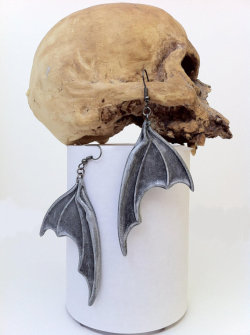 homoglobinopathy:  chastitytonight:   Bat Wing Earring Bloody Cleaver Earrings Skull Earrings Dancing Skeleton  Ah yes body jewerly for my zygomatic process, ethmoid bone, and foremen magnum finally! 😉  but seriously I want these 