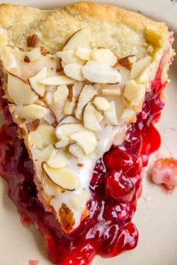 sweetoothgirl:  Cranberry Cherry Pie with Almond Glaze