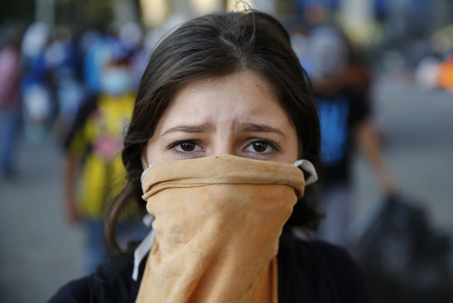 andreinandrea:  A Venezuelan protester poses for a portrait at Altamira square in Caracas. Estos son los estudiantes, que sin armas, protestan en Altamira, municipio Chacao, contra el gobierno de Nicolás Maduro, Jóvenes que luchan y arriesgan sus vidas