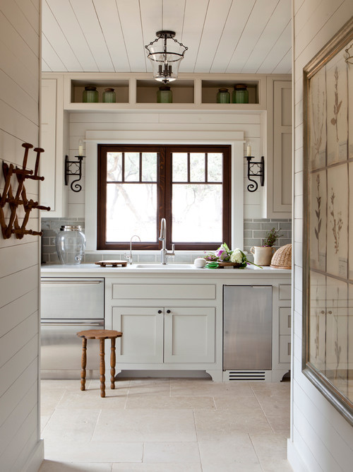 Get cookin’. Craftsman-style windows combine with a sleek white interior for an upscale yet accessible kitchen.