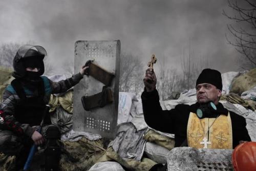 soldiers-of-war: UKRAINE. Kiev. February 20, 2014. Final Fight for Maidan. An orthodox priest blesse
