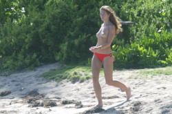 toplessbeachcelebs:  Rebecca Gayheart (Actress) topless on the beach (December 2003)