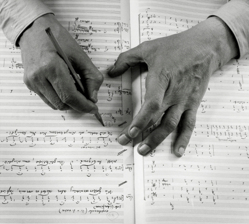 barcarole:Hands of German composer Carl Orff with his score for Antigonae - a musical setting after 