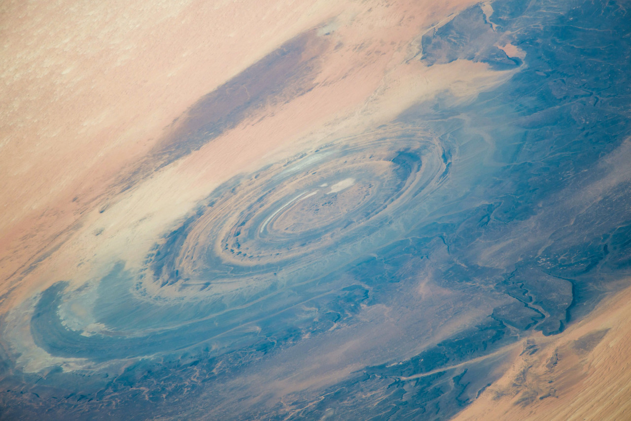 The Richat Structure (also known as the Eye of the Sahara) as photographed from the ISS. This geologic structure stretches almost 25 miles across the desert of central Mauritania.
Photo credit: NASA