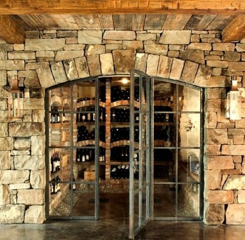 Rustic Wine Cellar - MediumInspiration For A Mid-sized Rustic Concrete Floor And Brown Floor Wine Cellar