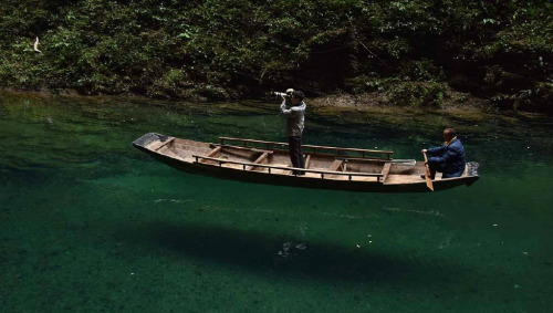 Valley in Ping Mountain屏山, Hefeng county鹤峰县, China. The water there is so clear that the boat is lik