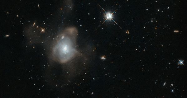 Just Pinned to Science: Hubble Captures a Galactic Waltz http://ift.tt/1HmWpoF