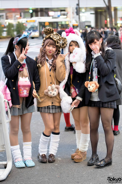 tokyo-fashion:  Shibuya girls in school uniforms, loose socks, and animal hats.