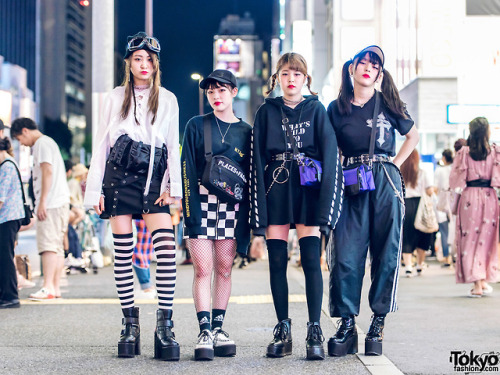 Japanese teen friends Kunieda, Mitsuki, Megumi, and Kaya wearing monochrome streetwear in Harajuku w