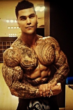 Handsome, sexy man with great looking pecs and awesome ink work.  WOOF